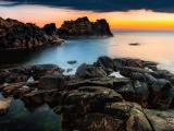 Sunset At A Rocky Coast