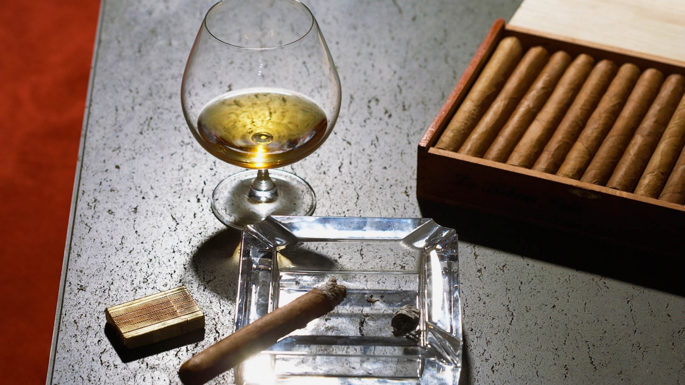 Close Up Of Cognac Glass And Cigars