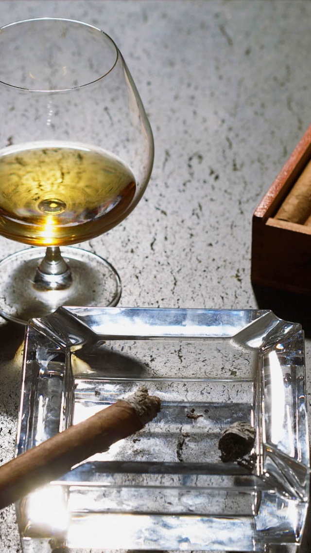 Close Up Of Cognac Glass And Cigars