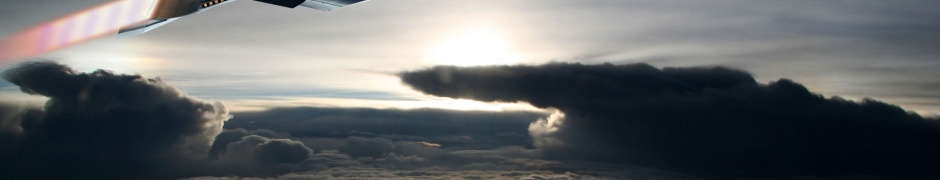 Fighter Aircraft Flying Out Of The Clouds