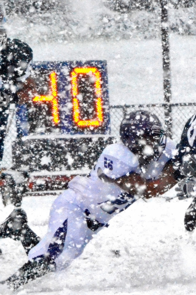 Football Match on a Snowy Blizzard