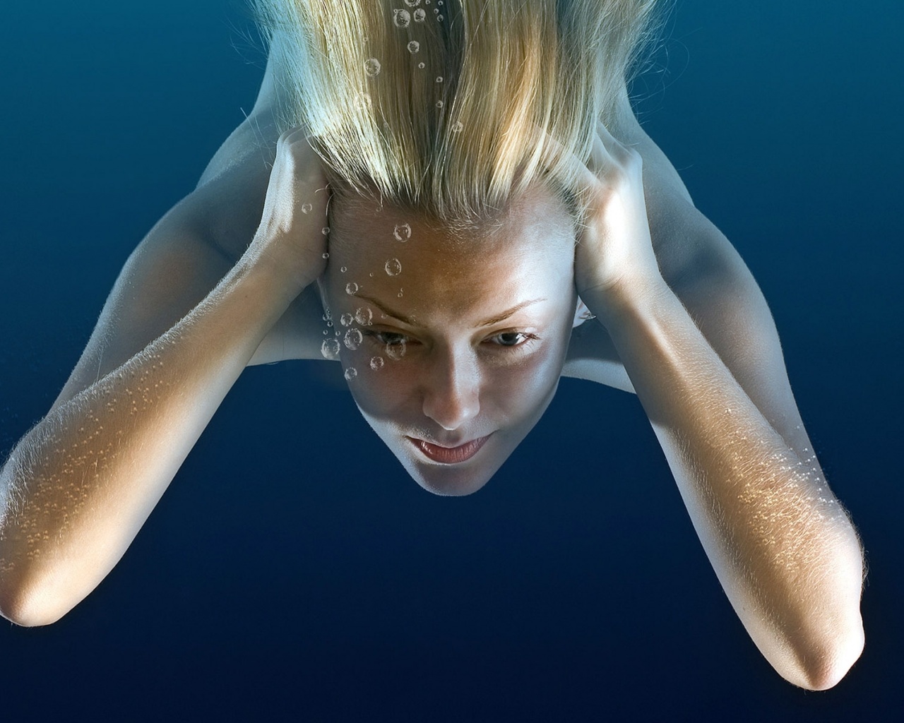 Girl Under Water Immersing Blonde Bubbles