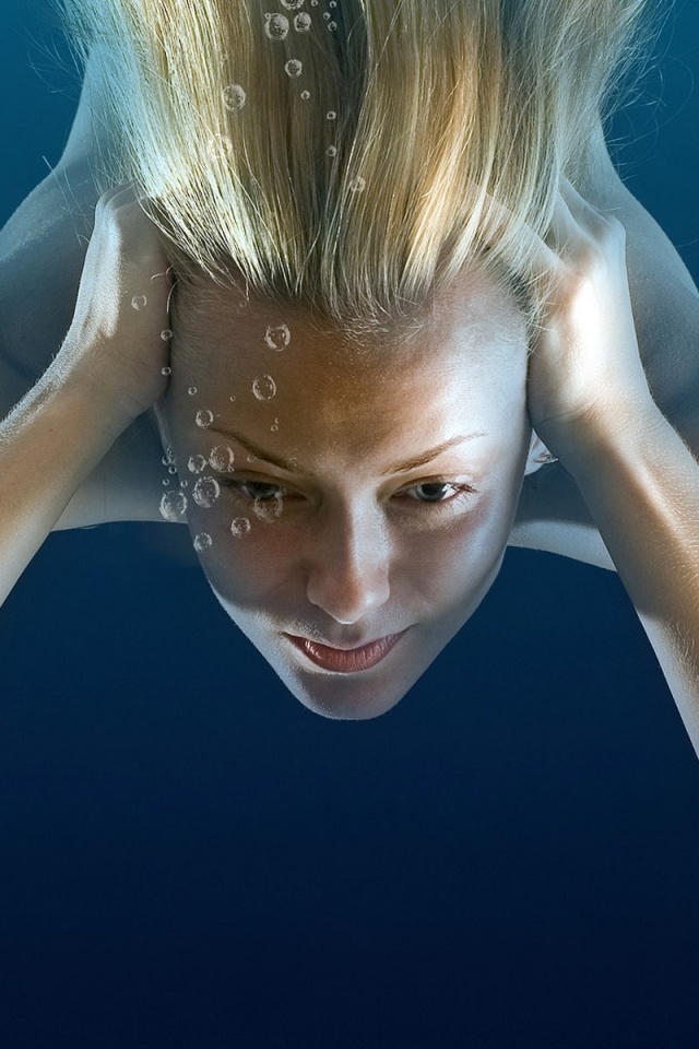 Girl Under Water Immersing Blonde Bubbles