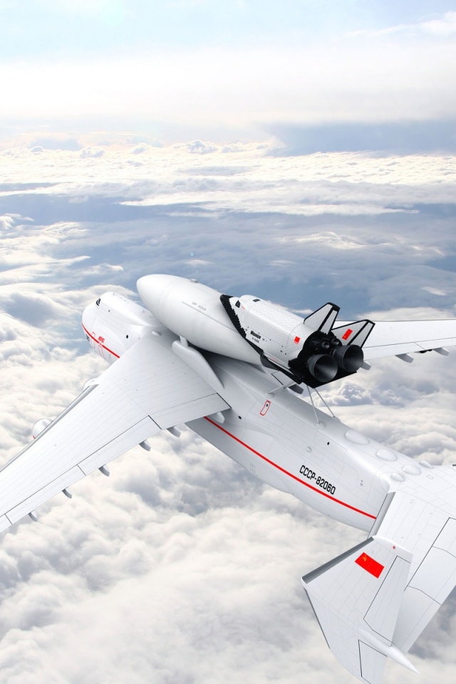 Large Aircraft Flying On The Clouds