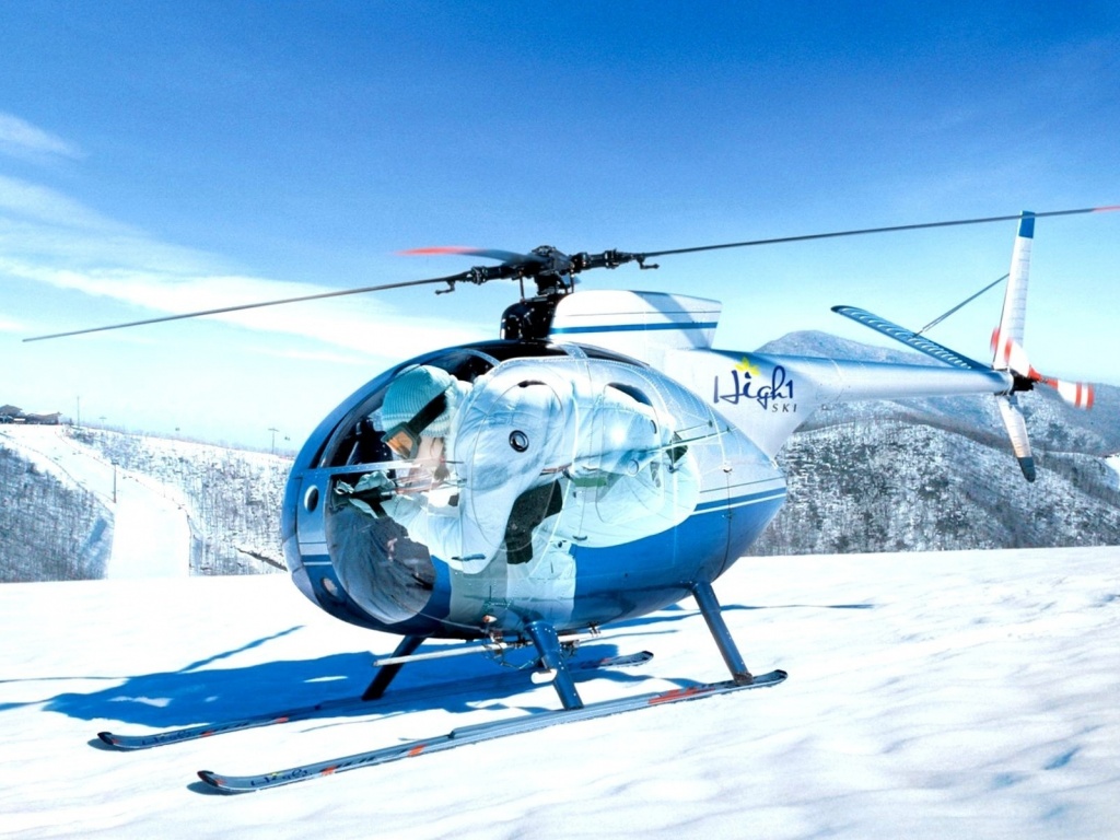 Mini Helicopters On The Snow Capped Mountain