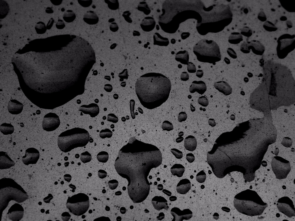 Puddled Water On Speckled Surface Texture