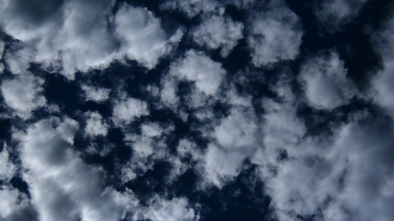 Puffy Clouds On Dark Blue Sky Texture