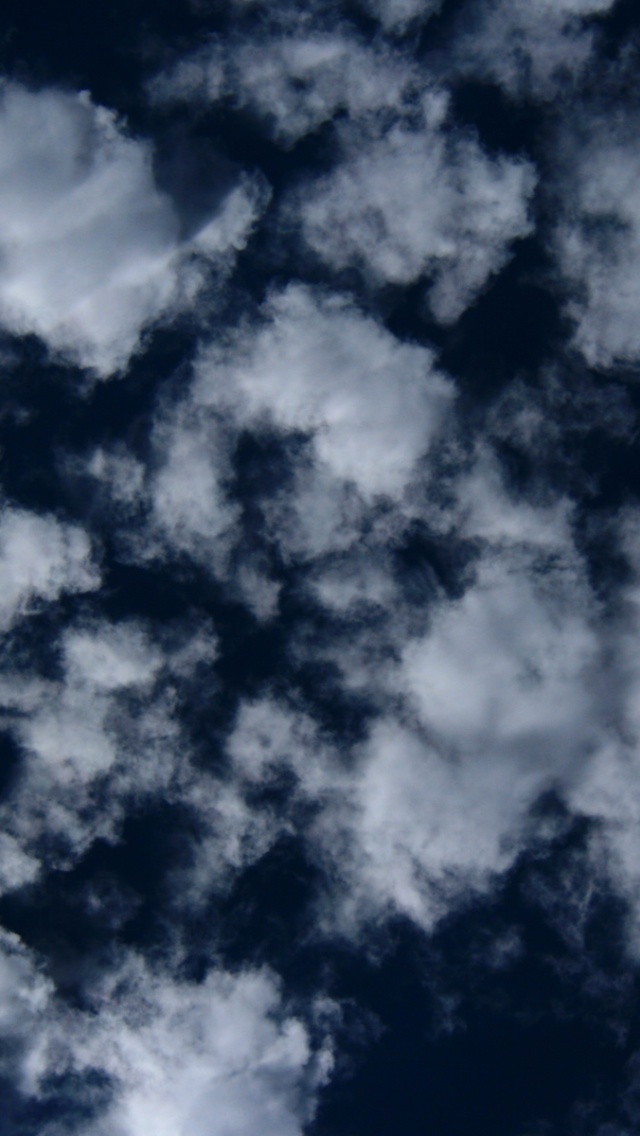 Puffy Clouds On Dark Blue Sky Texture