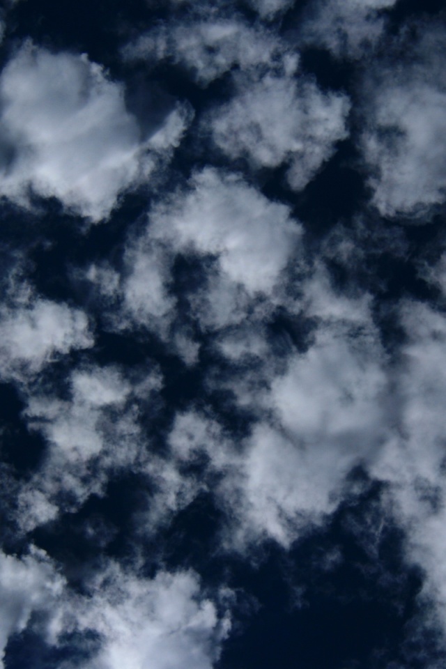 Puffy Clouds On Dark Blue Sky Texture