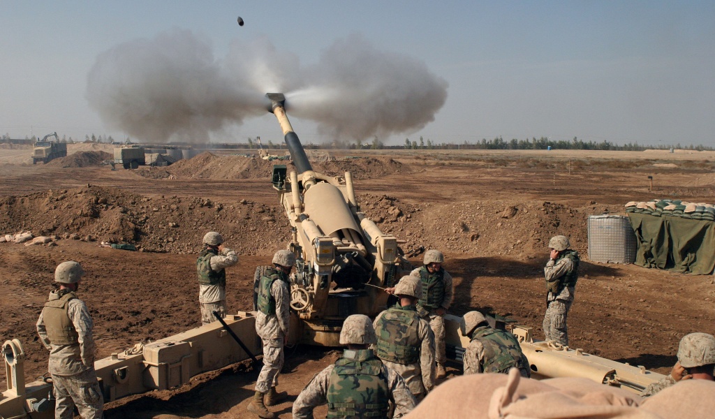 Soldiers Fire From Howitzers