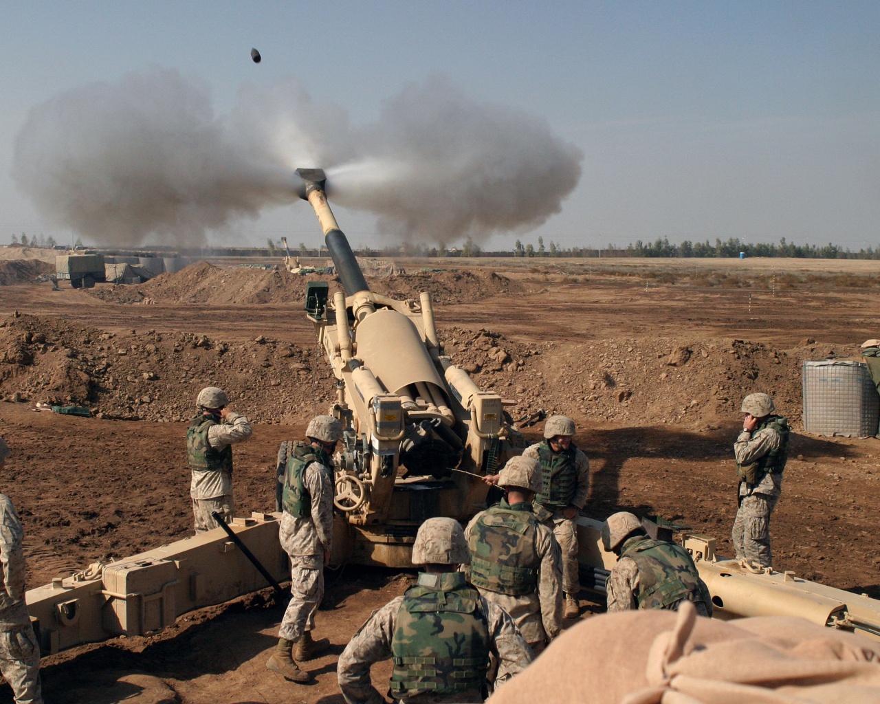 Soldiers Fire From Howitzers