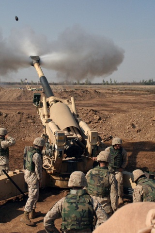 Soldiers Fire From Howitzers