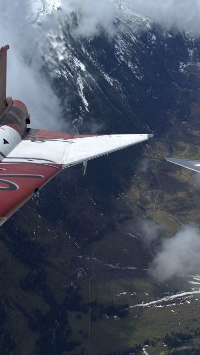 The Two Military Fighter Jets Flying Together